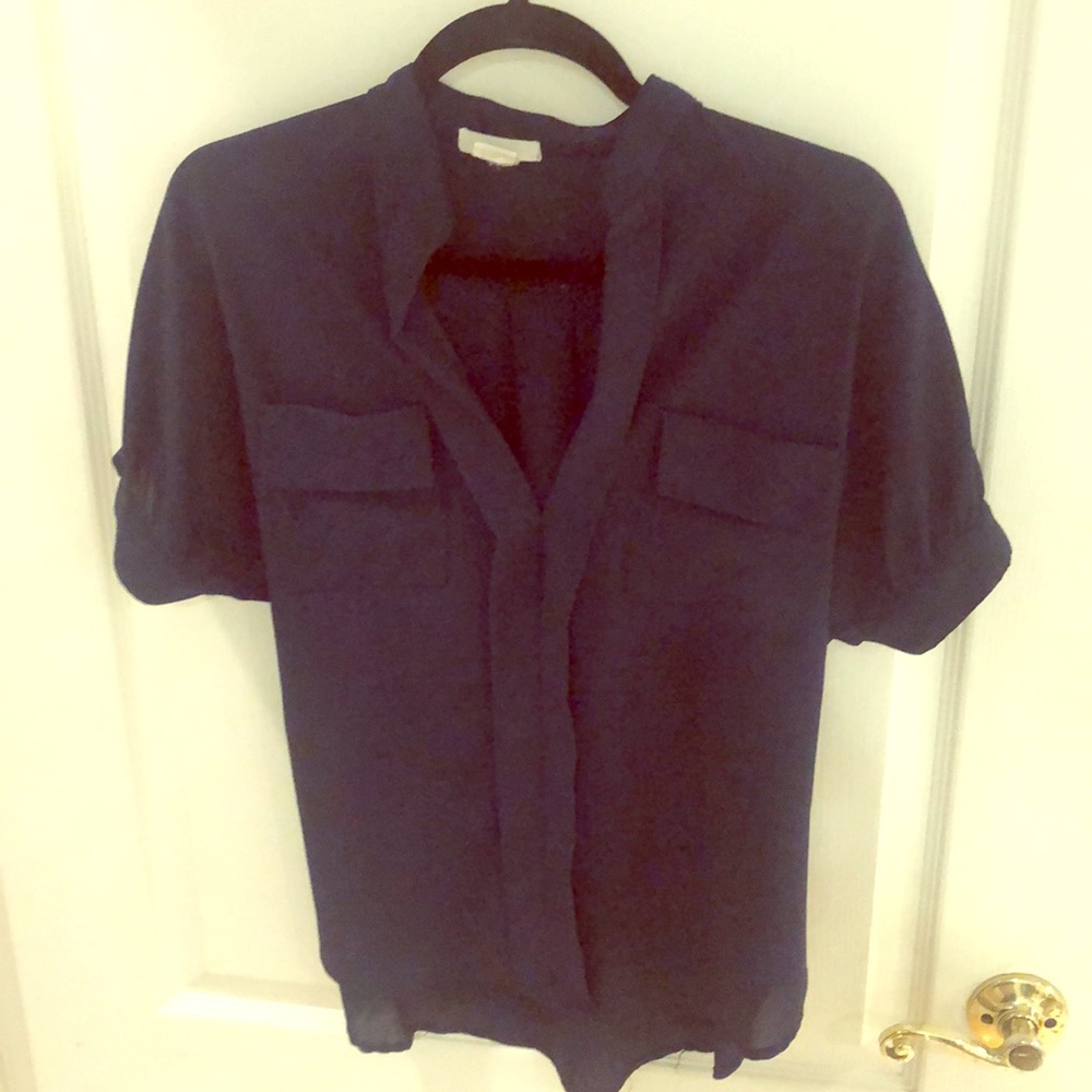 Very flattering navy blouse. Dress up or down!